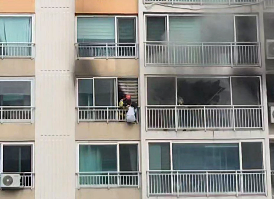 High School Girl Rescued After Clinging to Railing to Avoid Fire